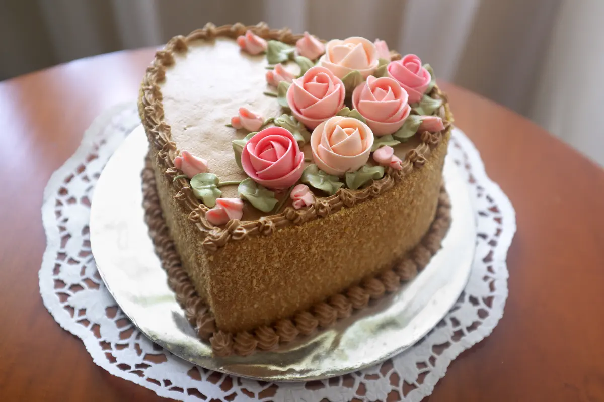 Mastering cake decorating techniques for a romantic heart cake