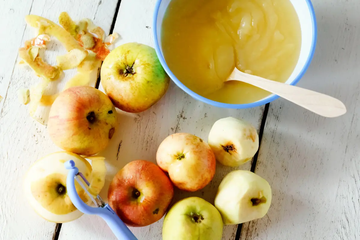 Preparation of cinnamon-infused applesauce, with ingredients spread on a table