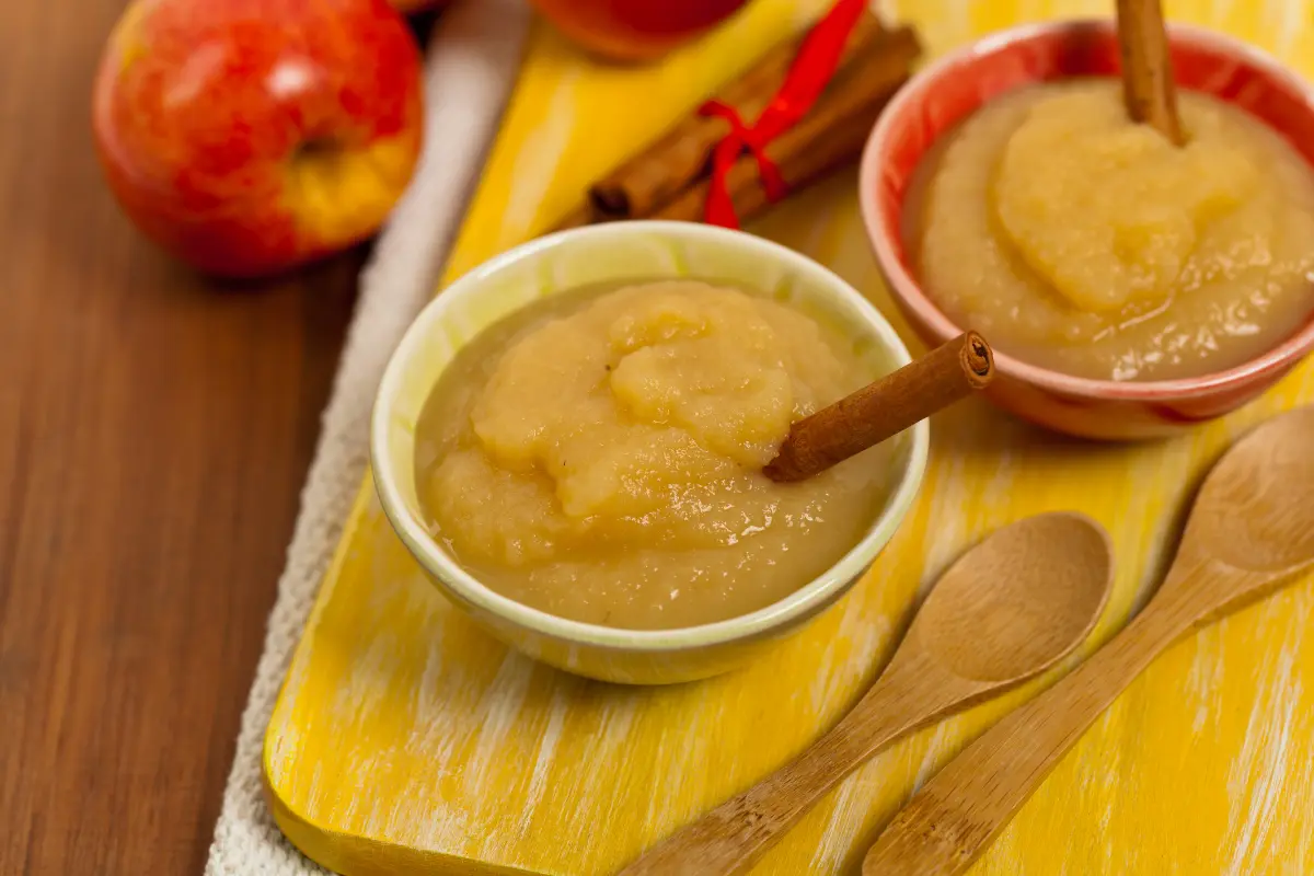 making cinnamon applesauce on kitchen counter.