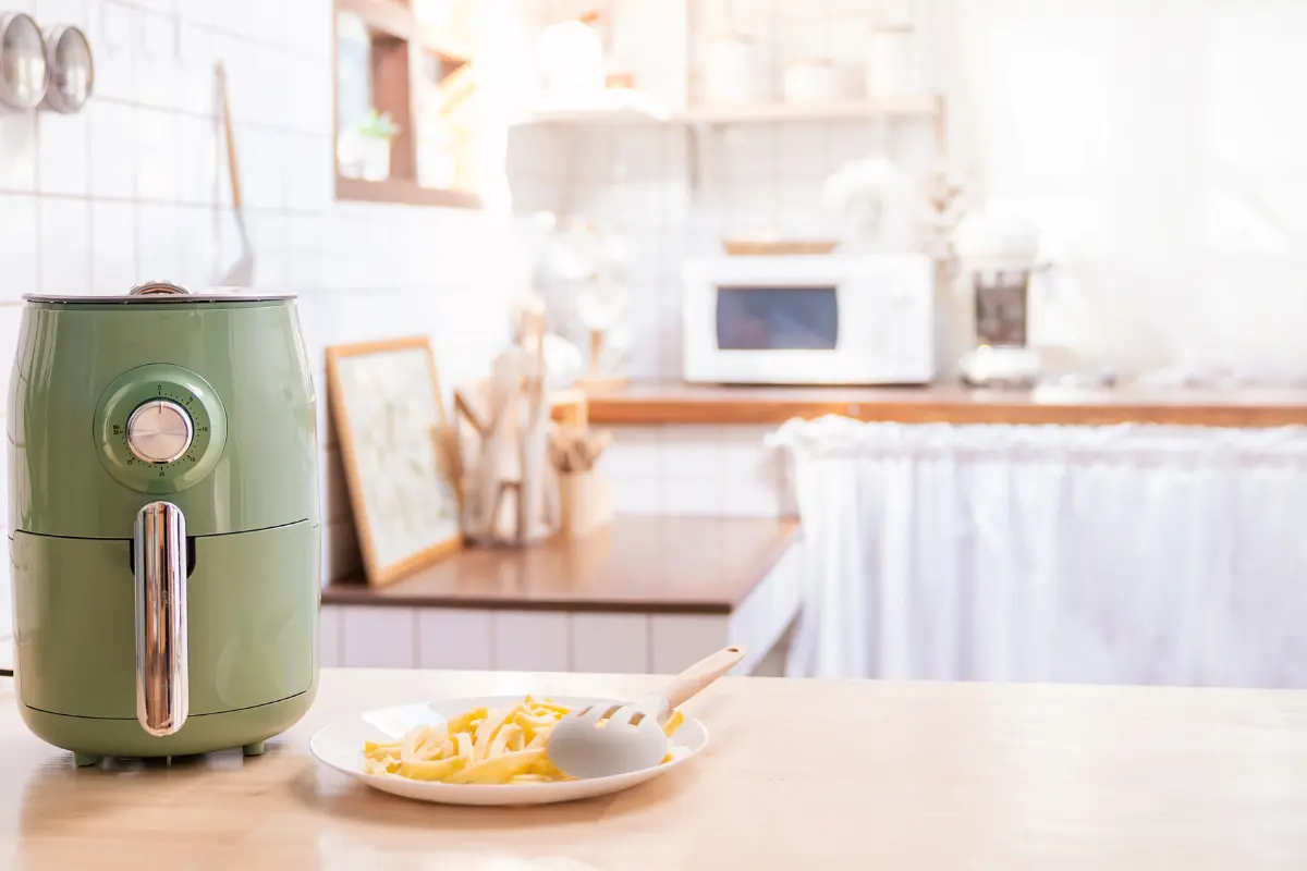 Air fryer cooking frozen fries to perfection.