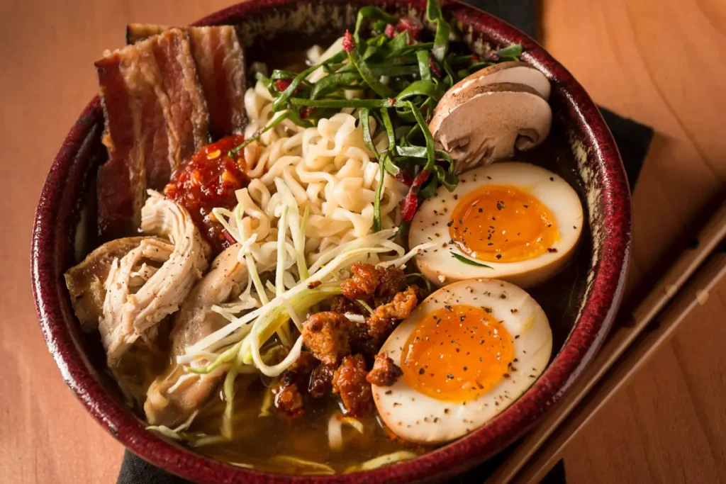 A cozy dinner setting with a steaming bowl of ramen at home.