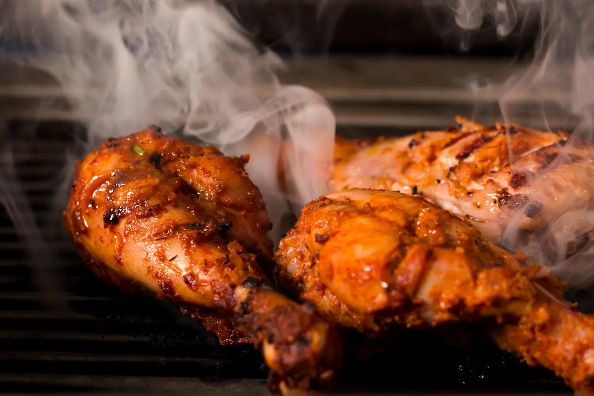 Smoked chicken breast on a grill