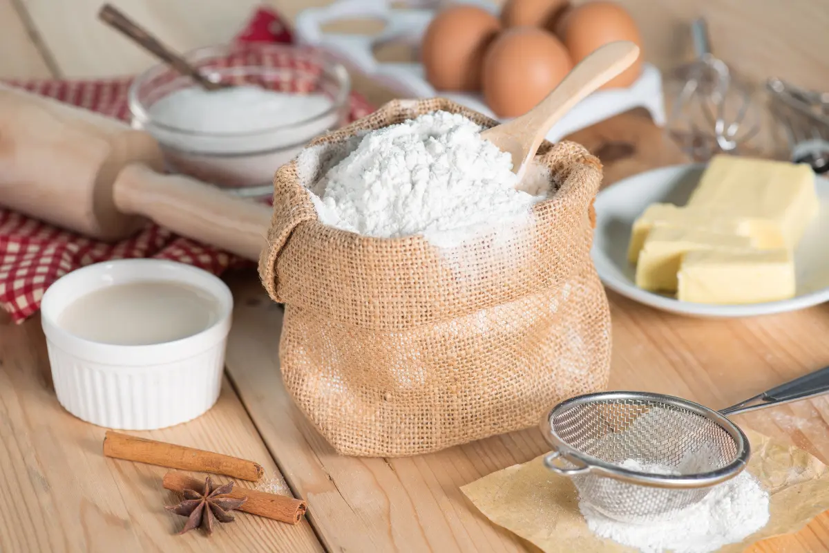 Ingredients and tools for baking a heart cake