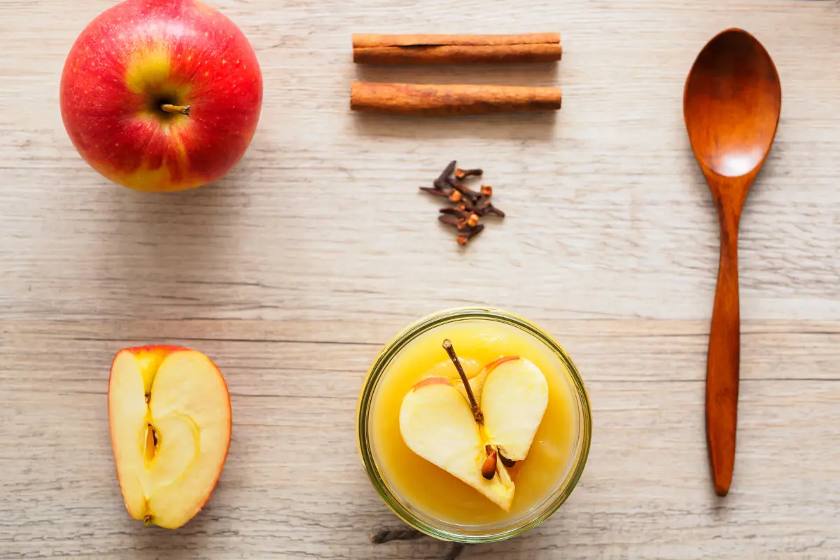  Ingredients for homemade applesauce preparation on a kitchen counter.